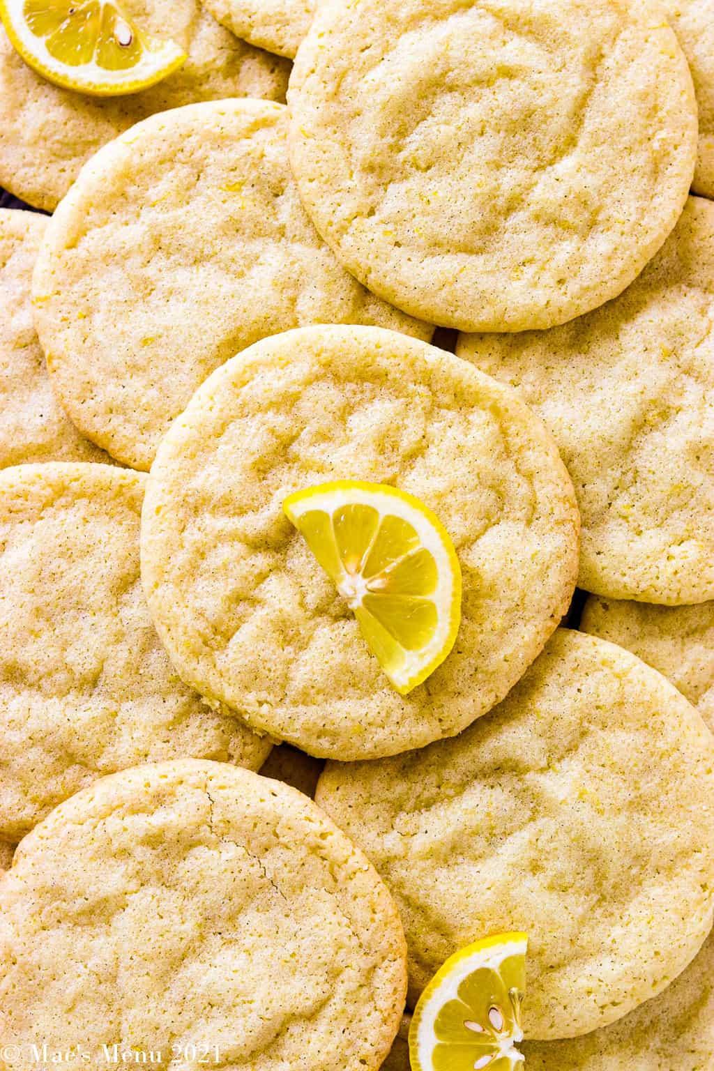An overhead shot of lemon sugar cookies sacked on each other
