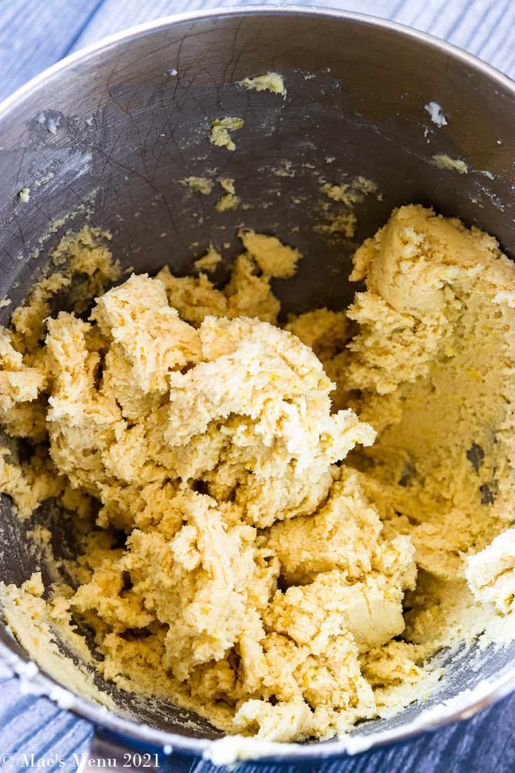 An overhead shot of a mixing bowl of lemon sugar cookie dough