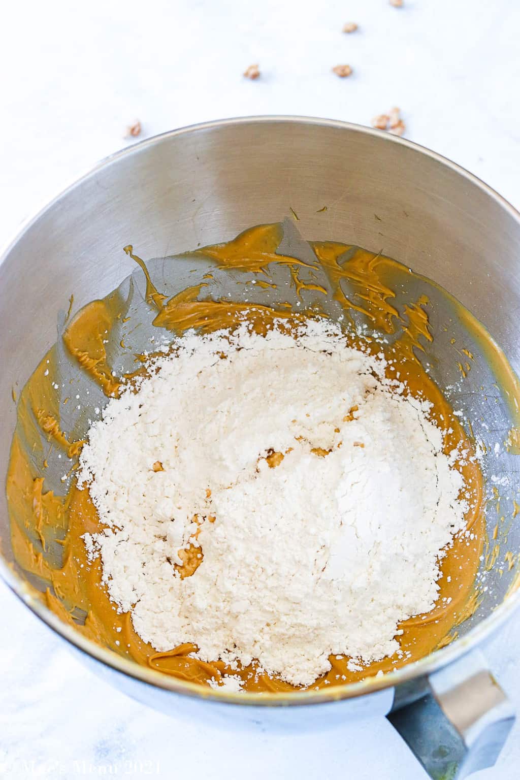 A mixing bowl of whipped peanut butter with confectioner's sugar
