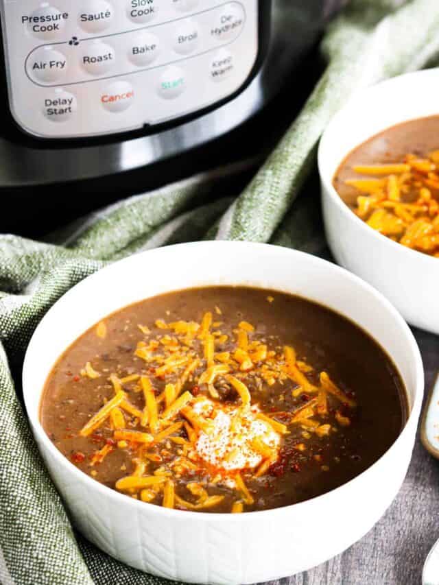 Two bowls of Instant Pot bean soup in front of a pressure cooker