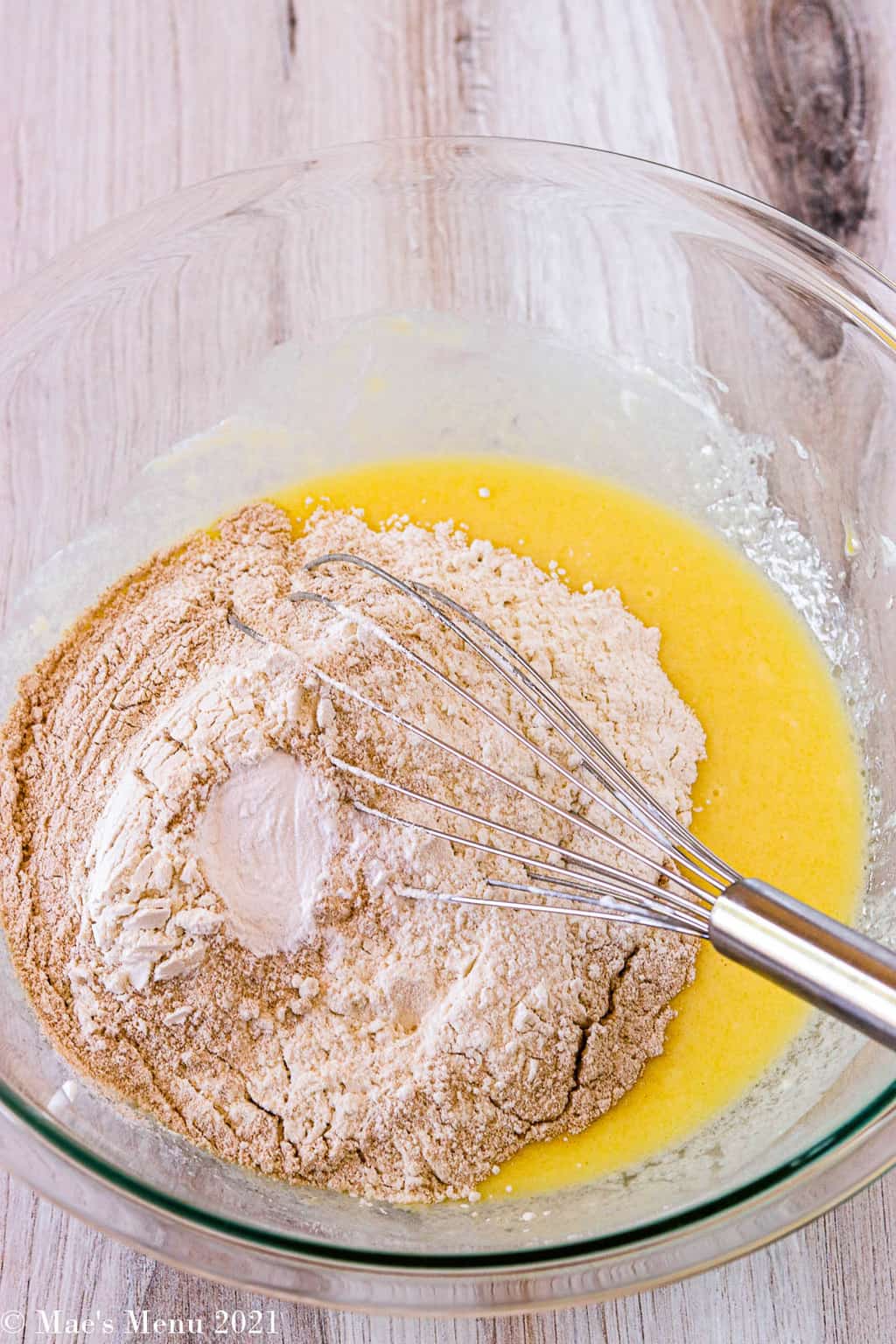 A mizing bowl with flour added to the egg mixture