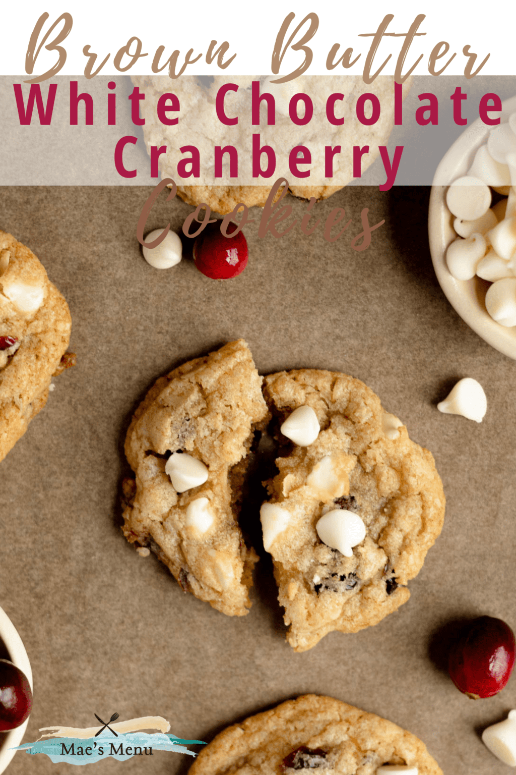 A pinterest pin for brown butter white chocolate cranberry cookies with a photo of the cookies on a cookie sheet with one of the cookies split in half