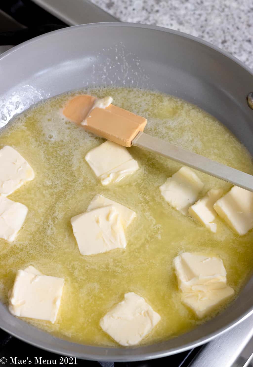 Melting butter in a large skillet
