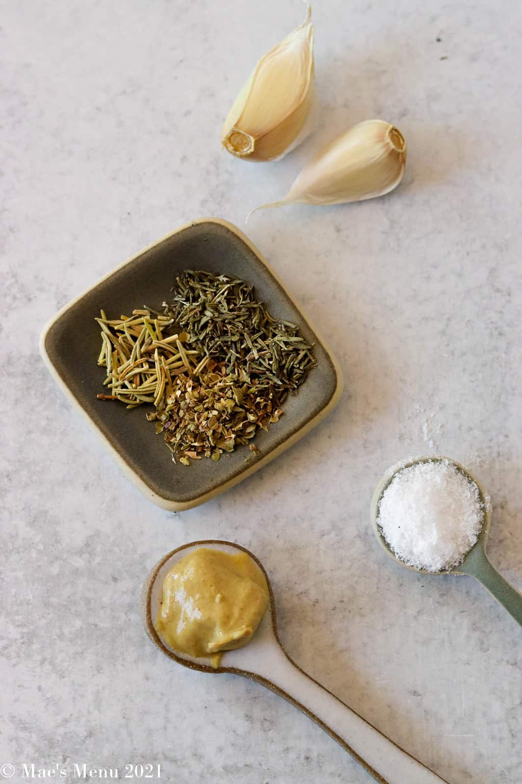 Garlic cloves, dried herbs, salt, and Dijon mustard