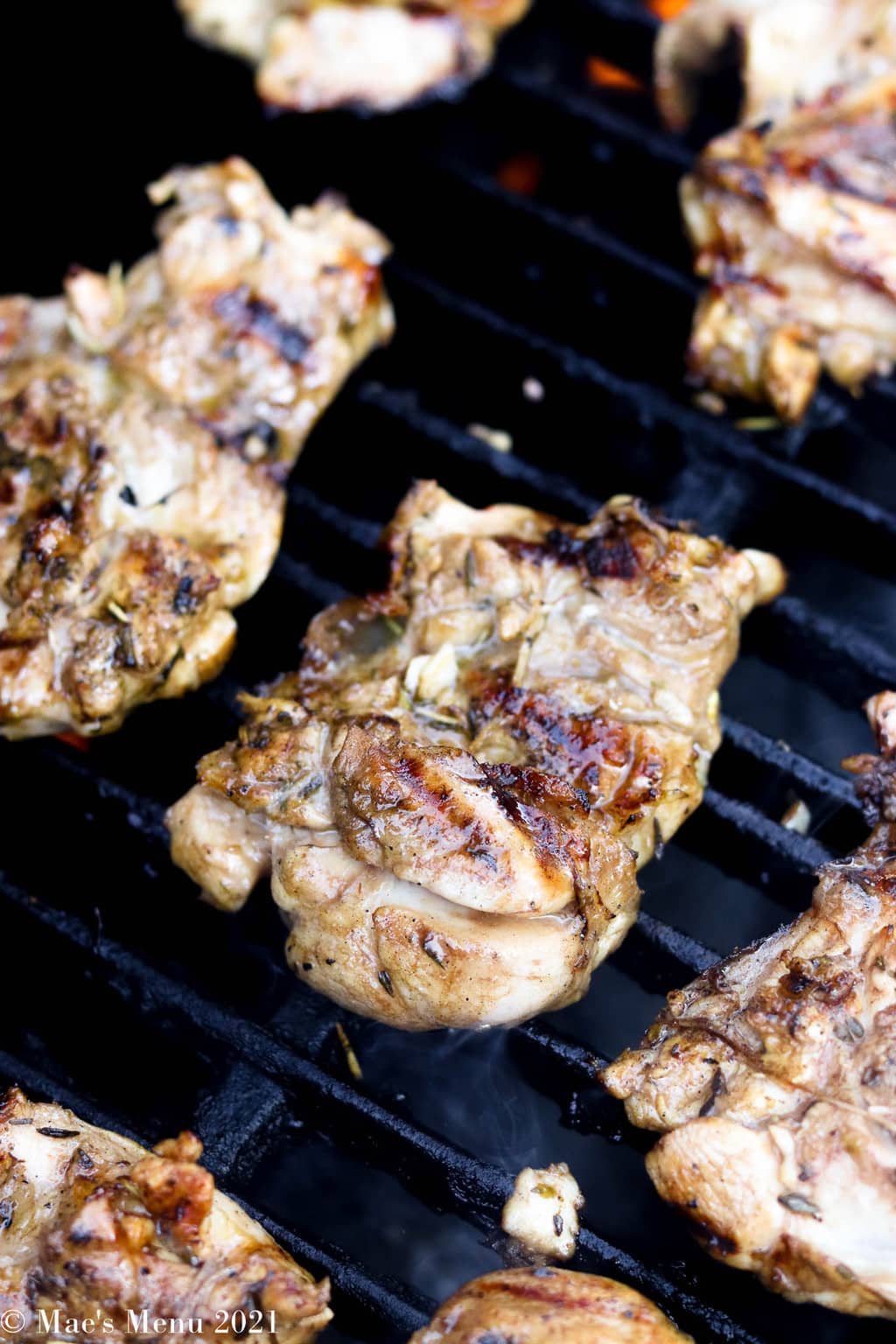 Marinated chicken thighs on the grill