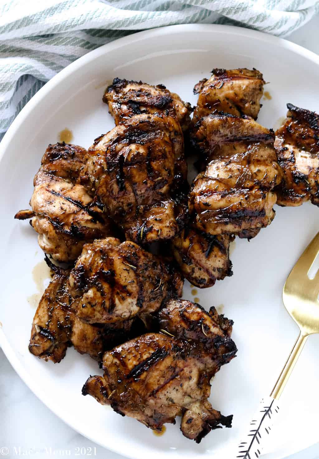 An up-close overhead shot of grilled chicken thighs