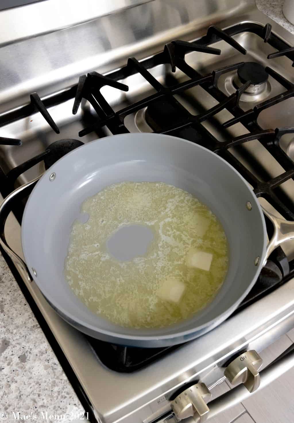Melting butter in a pan on the gas range