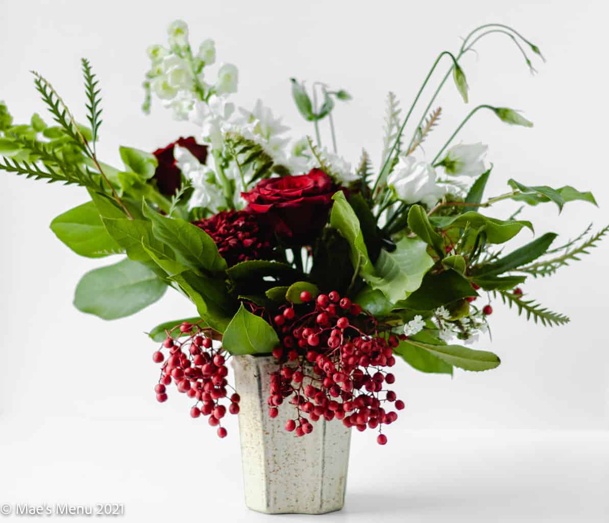 A side shot of a Christmas bouquet on a white background.