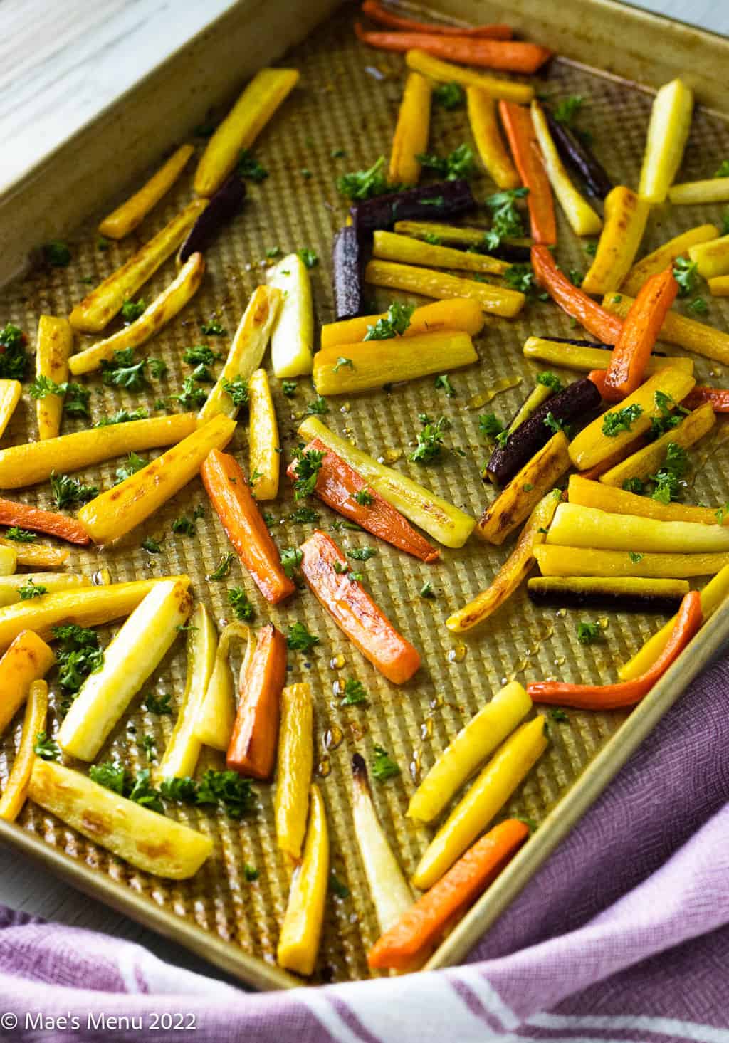 A large roasted pan full of rainbow carrots.
