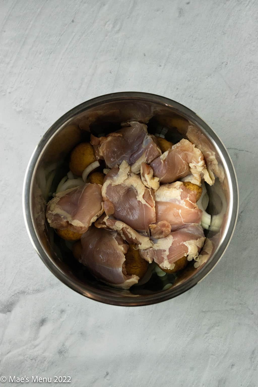Chicken in the bowl of an Instant Pot.