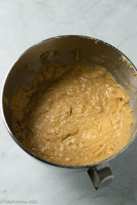A mixing bowl of brown butter banana bread batter.