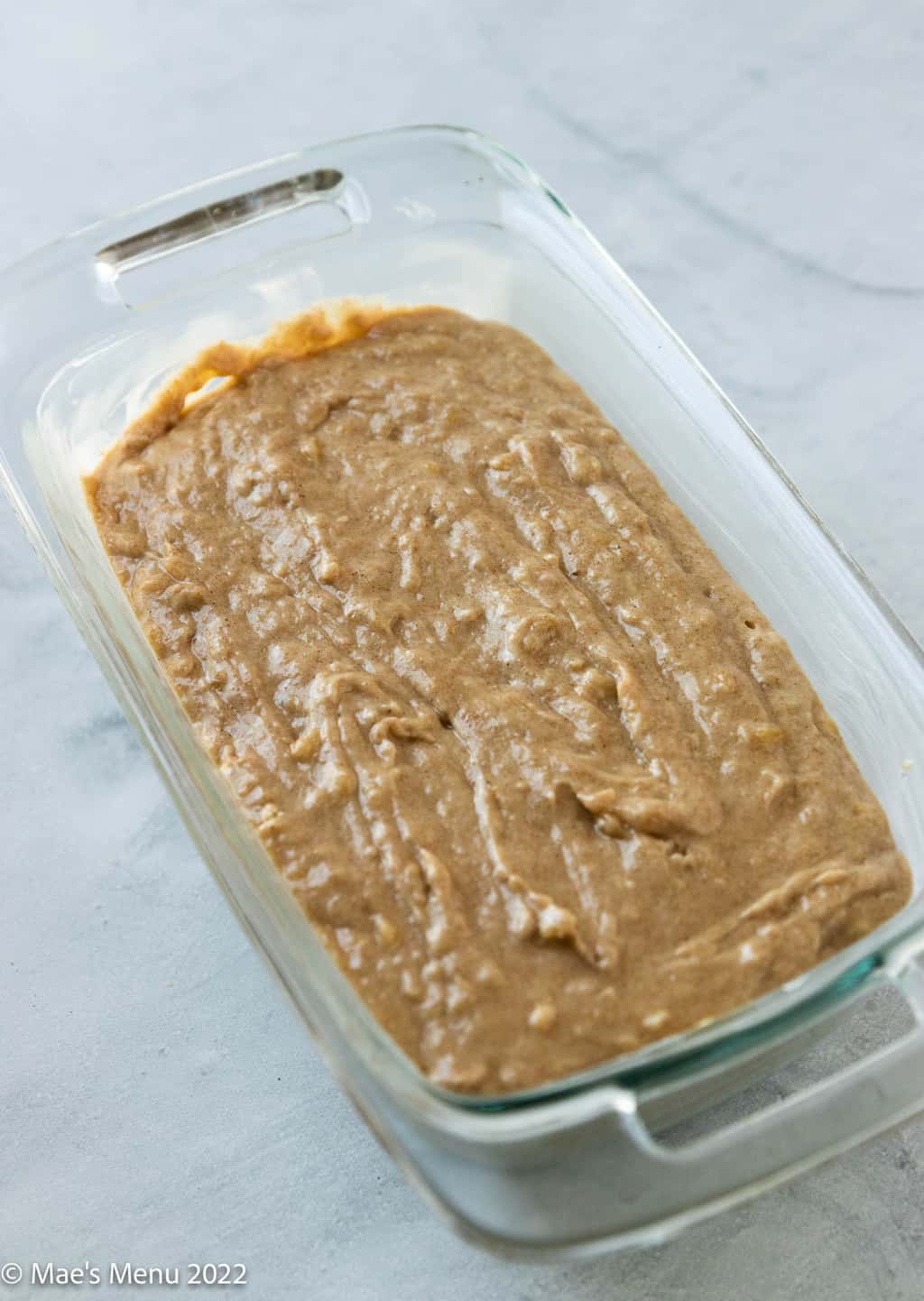 A loaf pan of the brown butter banana bread batter.