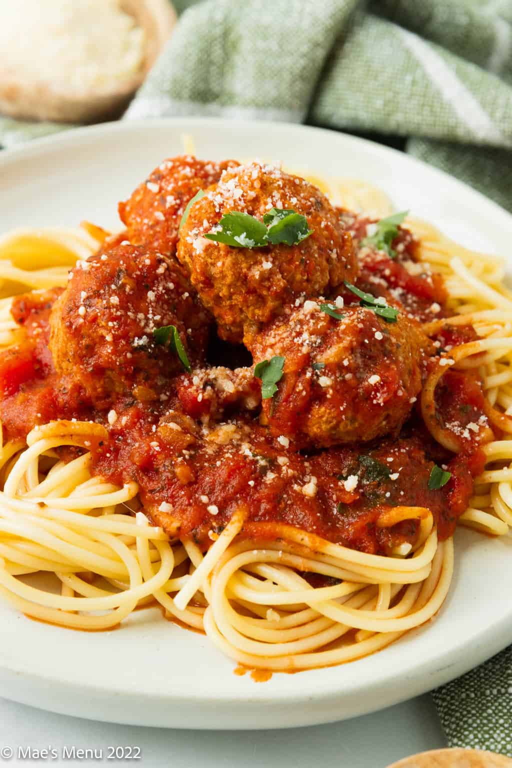 An up-close shot of a plate of spaghetti with instant pot meatballs.