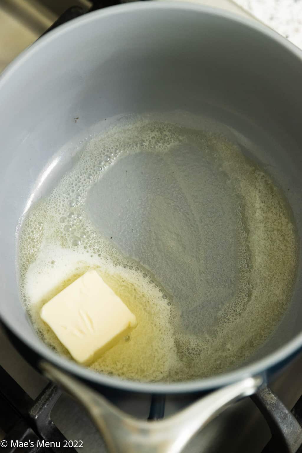 A saucepan with melted butter.