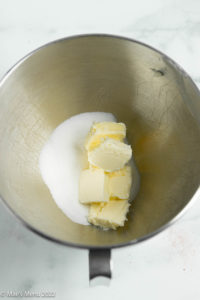 A mixing bowl of butter and sugar.