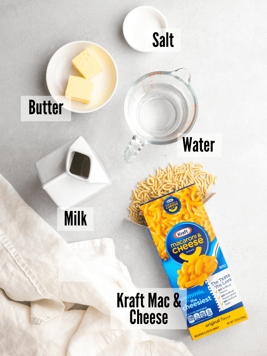 The ingredients for instant pot kraft mac and cheese, milk, butter, water, salt, and a box of kraft mac and cheese. 