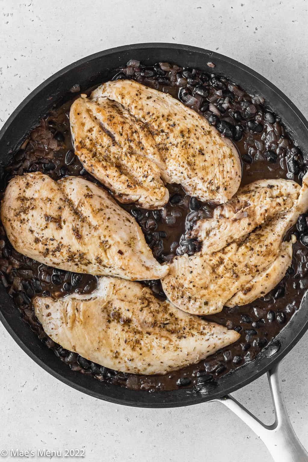 Chicken nestled in the black bean sauce.