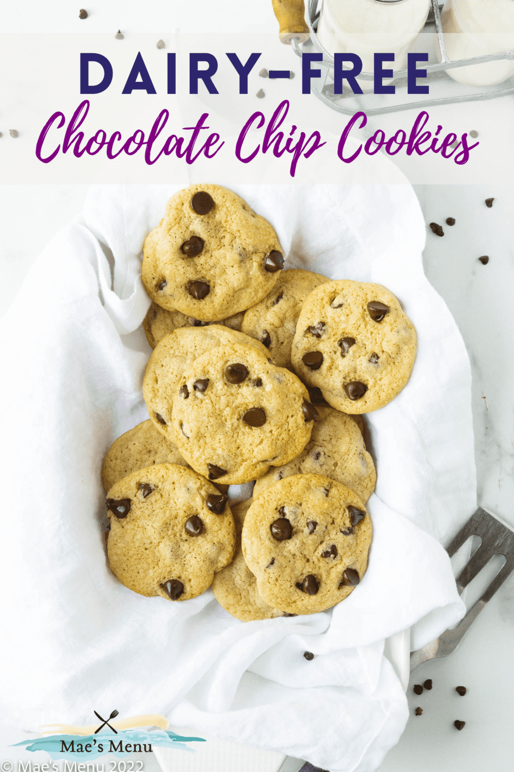 A Pinterest pin for dairy-free chocolate chip cookies with an overhead shot of a basket of the cookies.