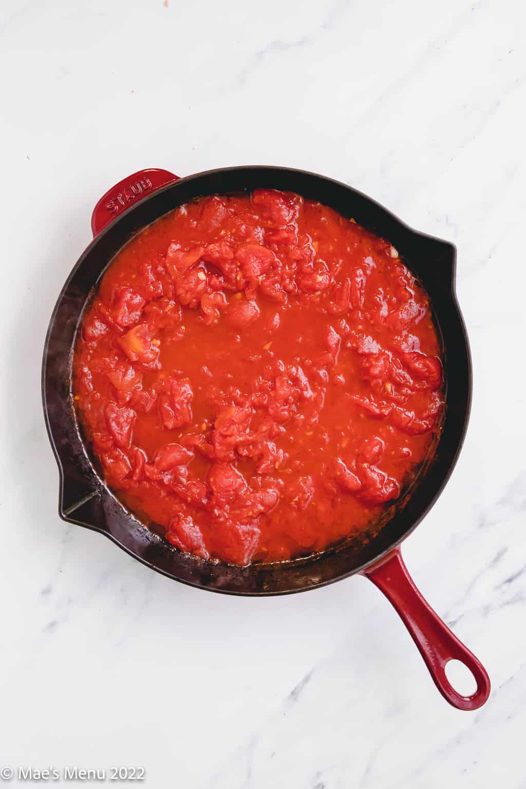 A large skillet of tomato sauce.