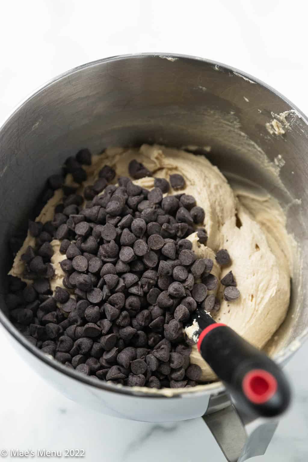 A mixing bowl of dairy free chocolate chip cookie dough before mixing.