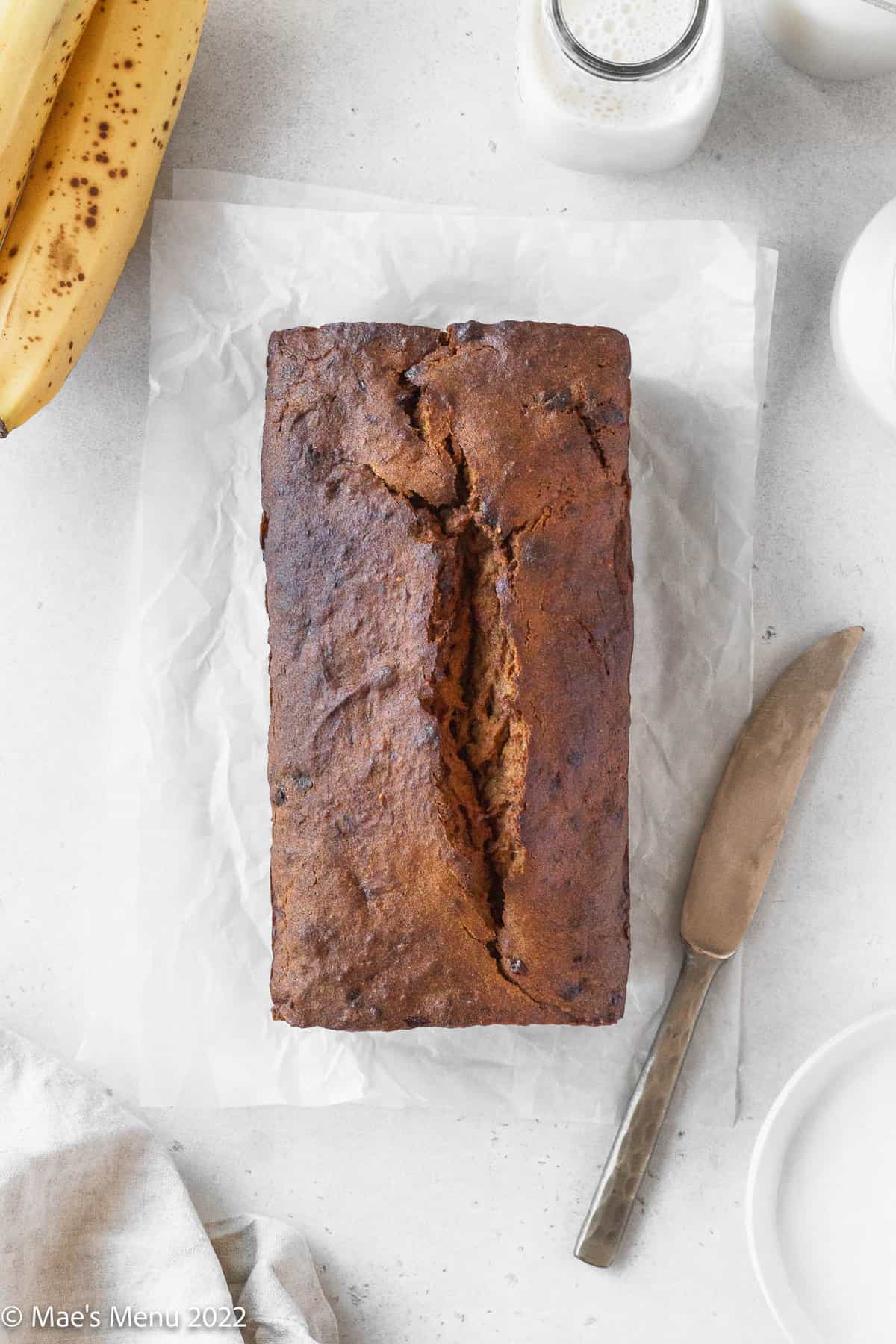 An overhead shot of a baked loaf of dairy free banana bread.