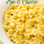 vertical image of a bowl of lactose-free mac and cheese with text overlay.