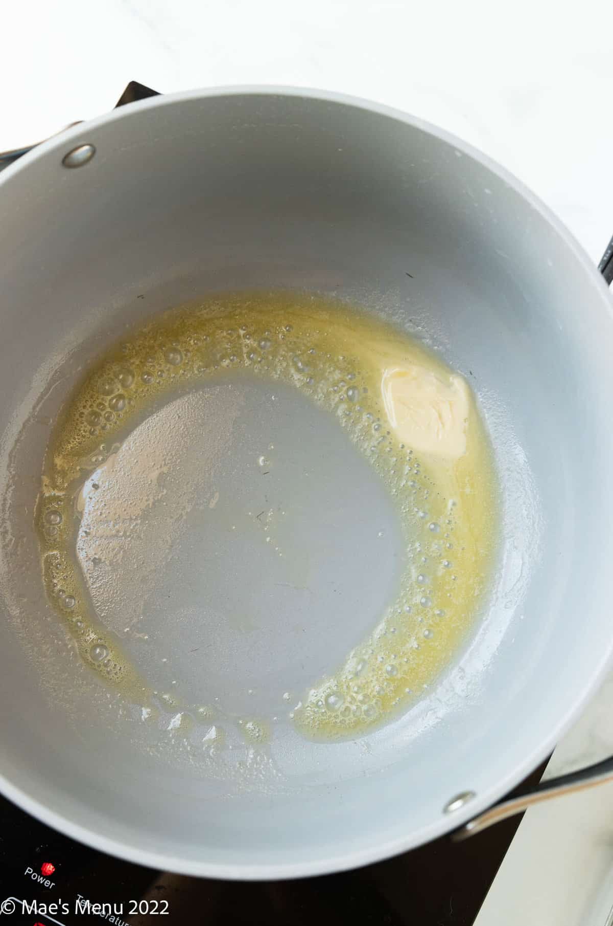 melting vegan butter in a pot.