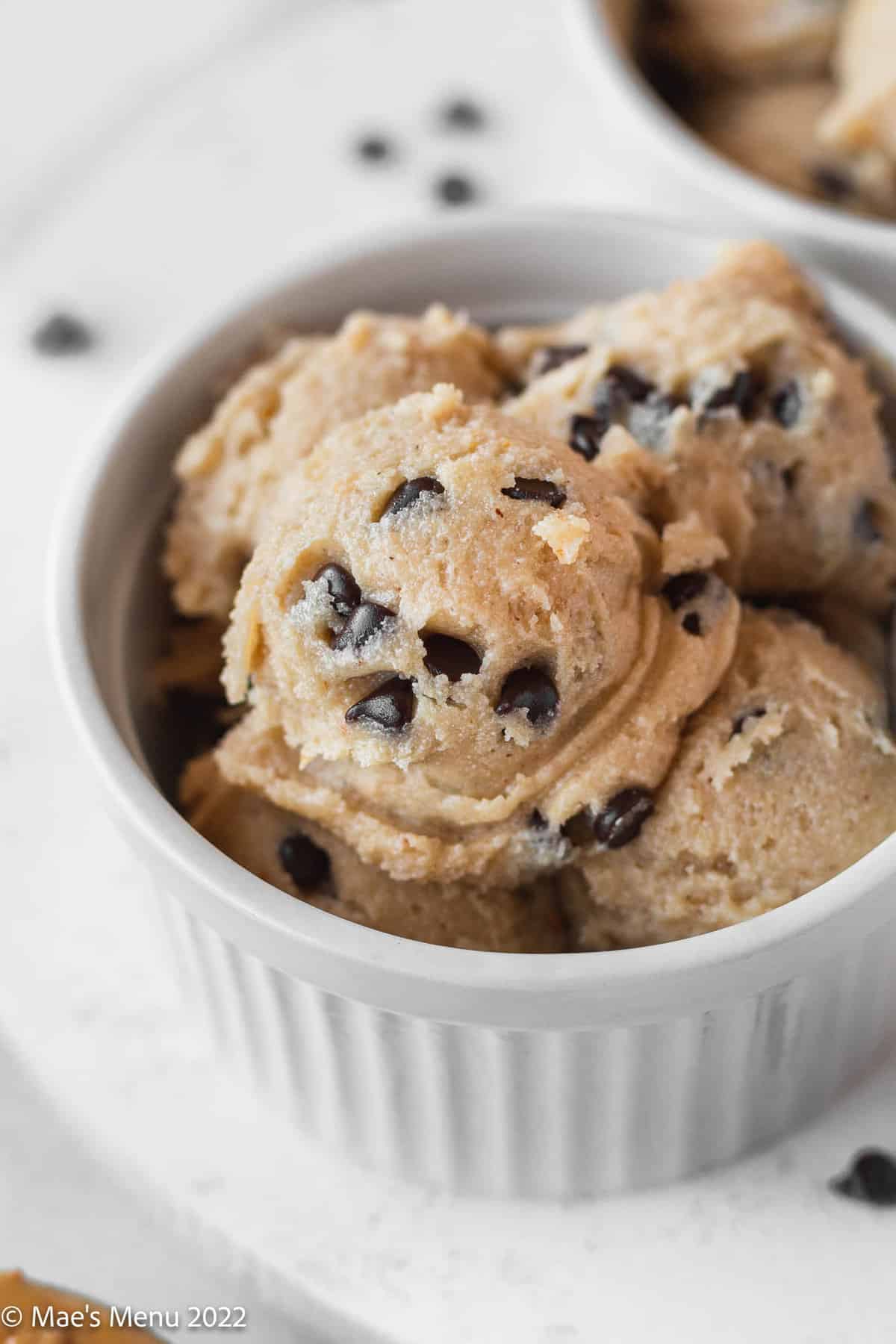 small scoops of peanut butter cookie dough in a white bowl.