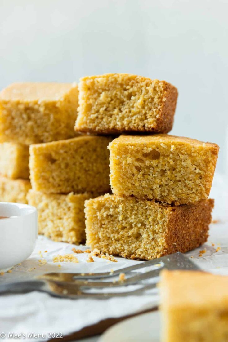 A stack of cornbread made without milk on the counter.