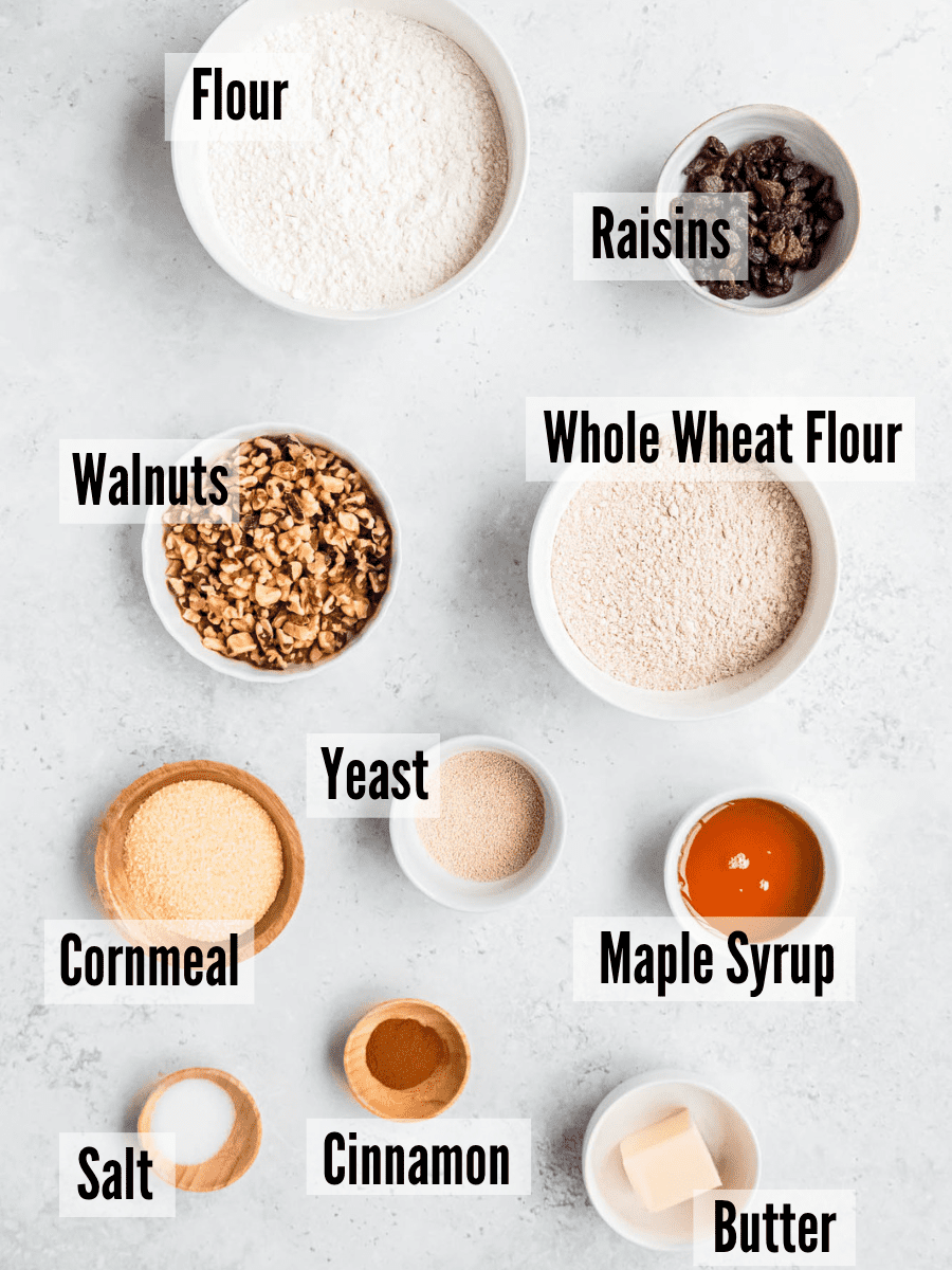 All of the ingredients for walnut bread on a light grey background.