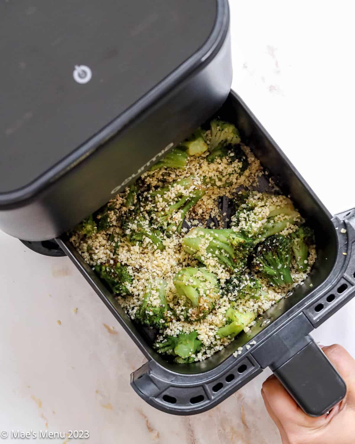 Putting the broccoli with breadcrumbs back in to air fry.