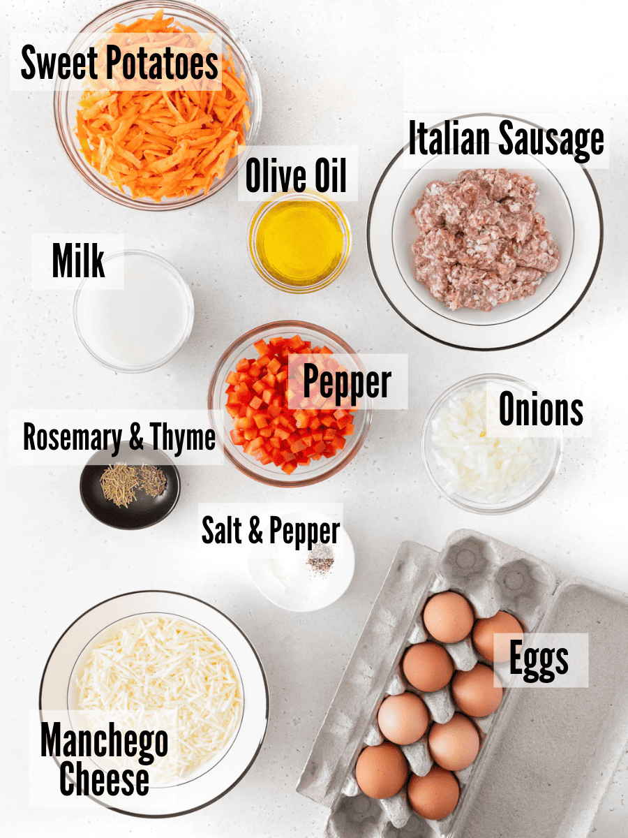 All of the ingredients for sweet potato & sausage frittata on a white background.