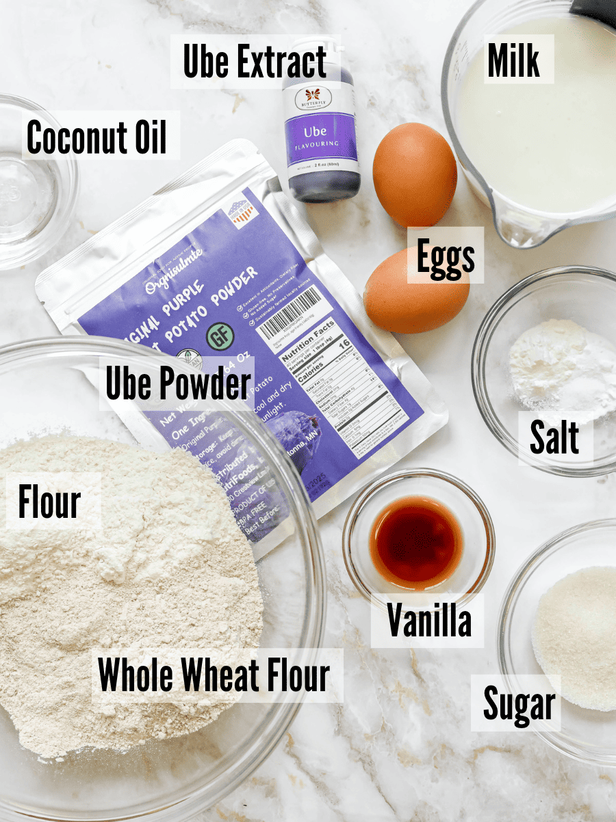 All of the ingredients for ube pancakes on a white background.