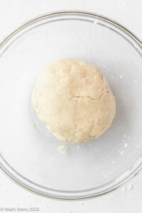 A ball of the shortbread dough in the glass mixing bowl.