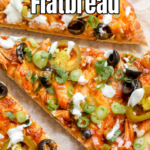 A pinterest pin for BBQ Chicken Flatbread with an overhead shot of a sliced flatbread on parchment paper.