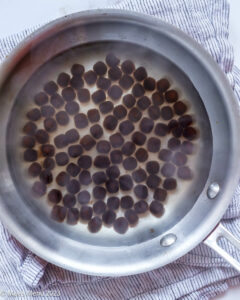 Cooking boba pearls in a saucepan.