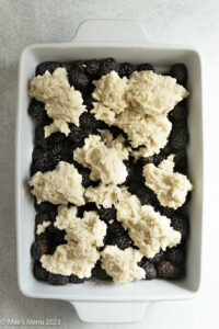 A pan of gluten-free blackberry cobbler before baking.