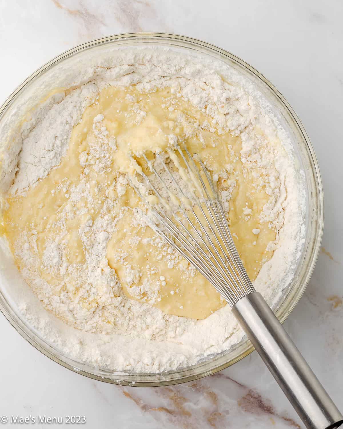 A mixing bowl of the pineapple poke cake batter.