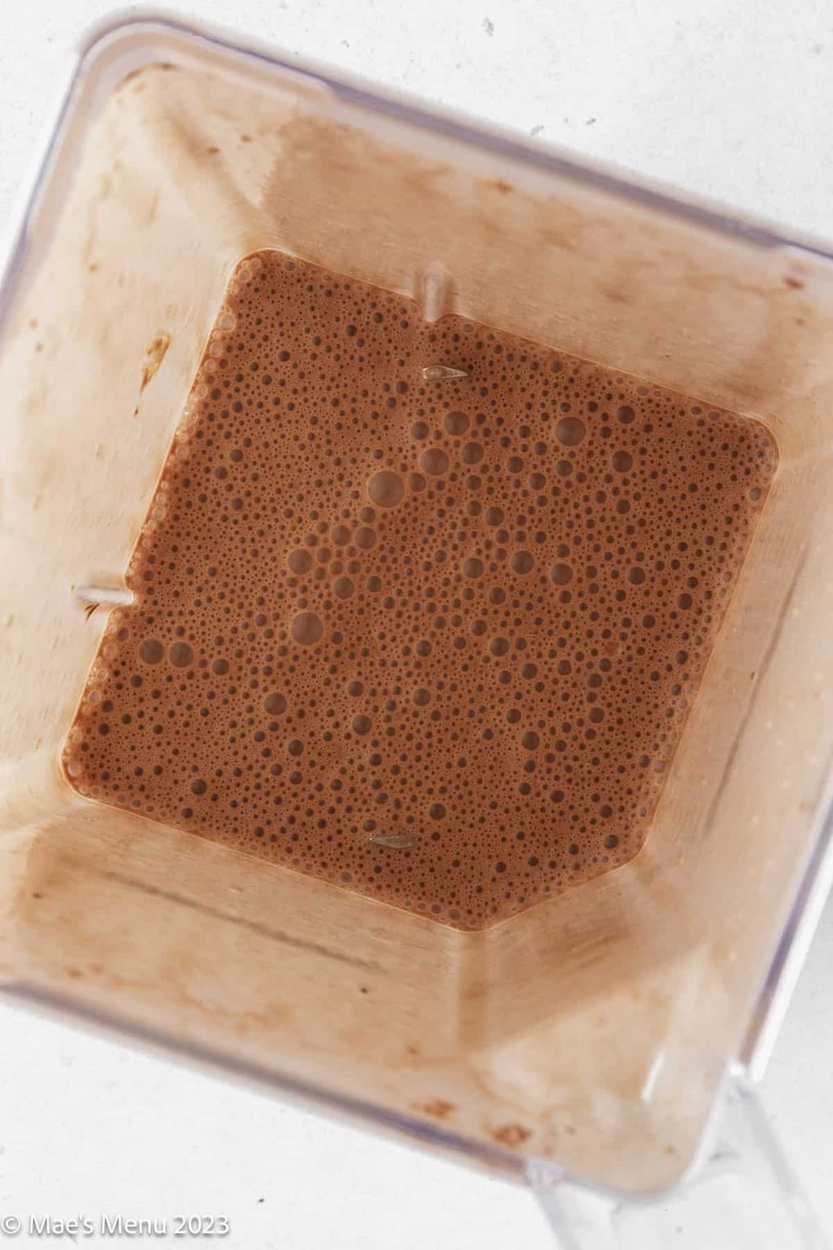 The blender of chocolate peanut butter protein shake.
