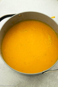 A pot of pureed vegan butternut squash soup.