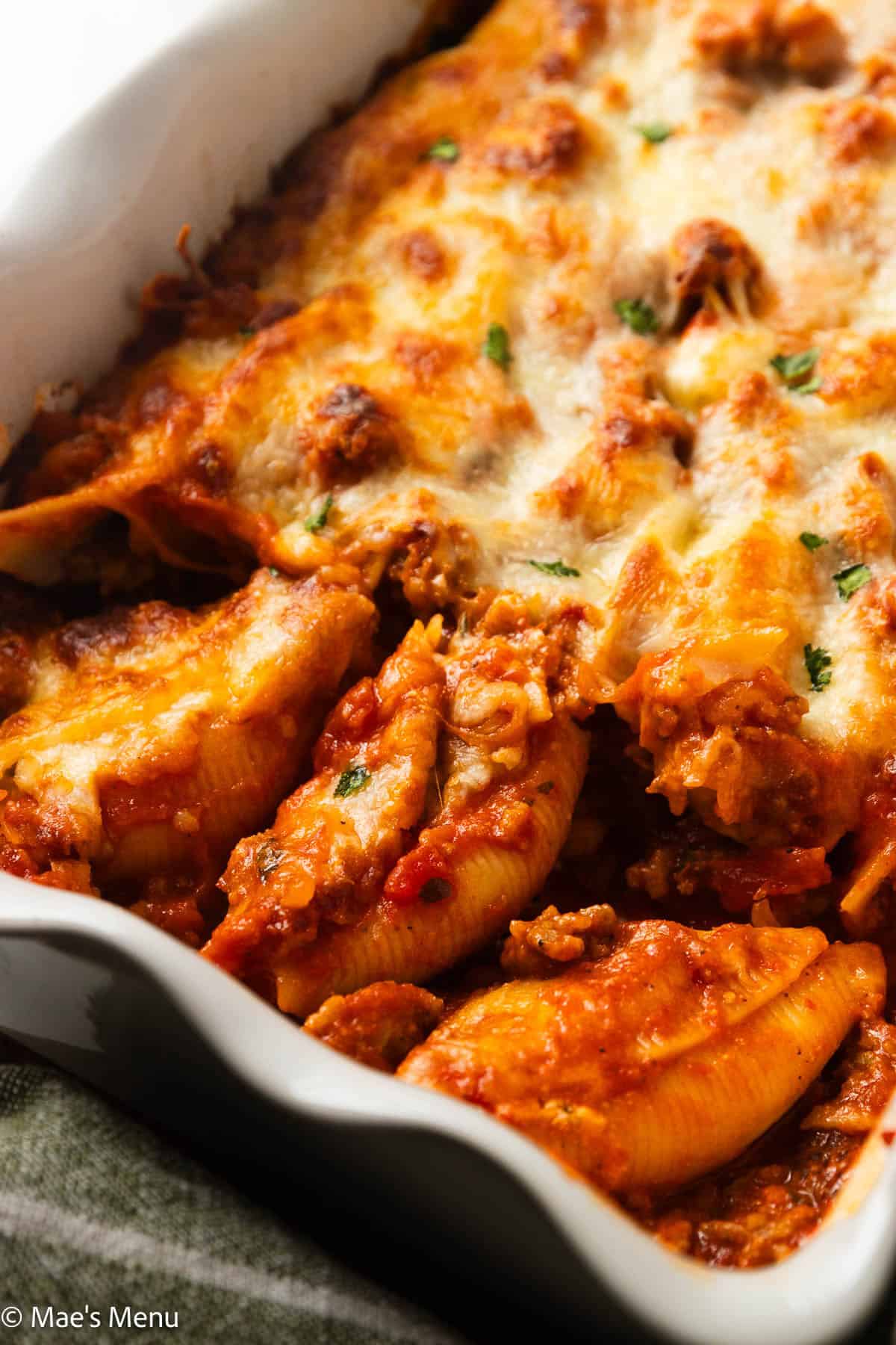 A close-up shot of the stuffed shells with ricotta in a pan.