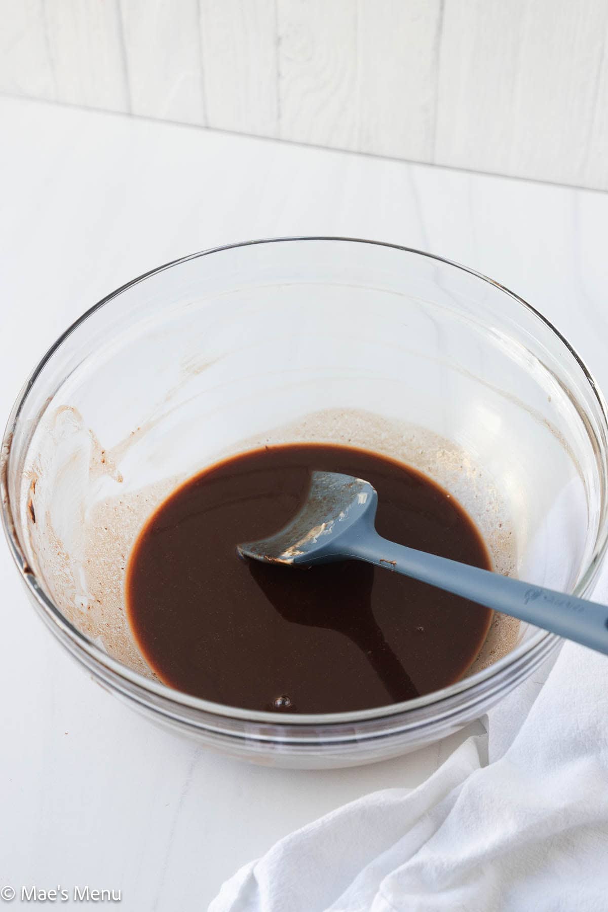 Melted chocolate and butter in a mixing bowl. 