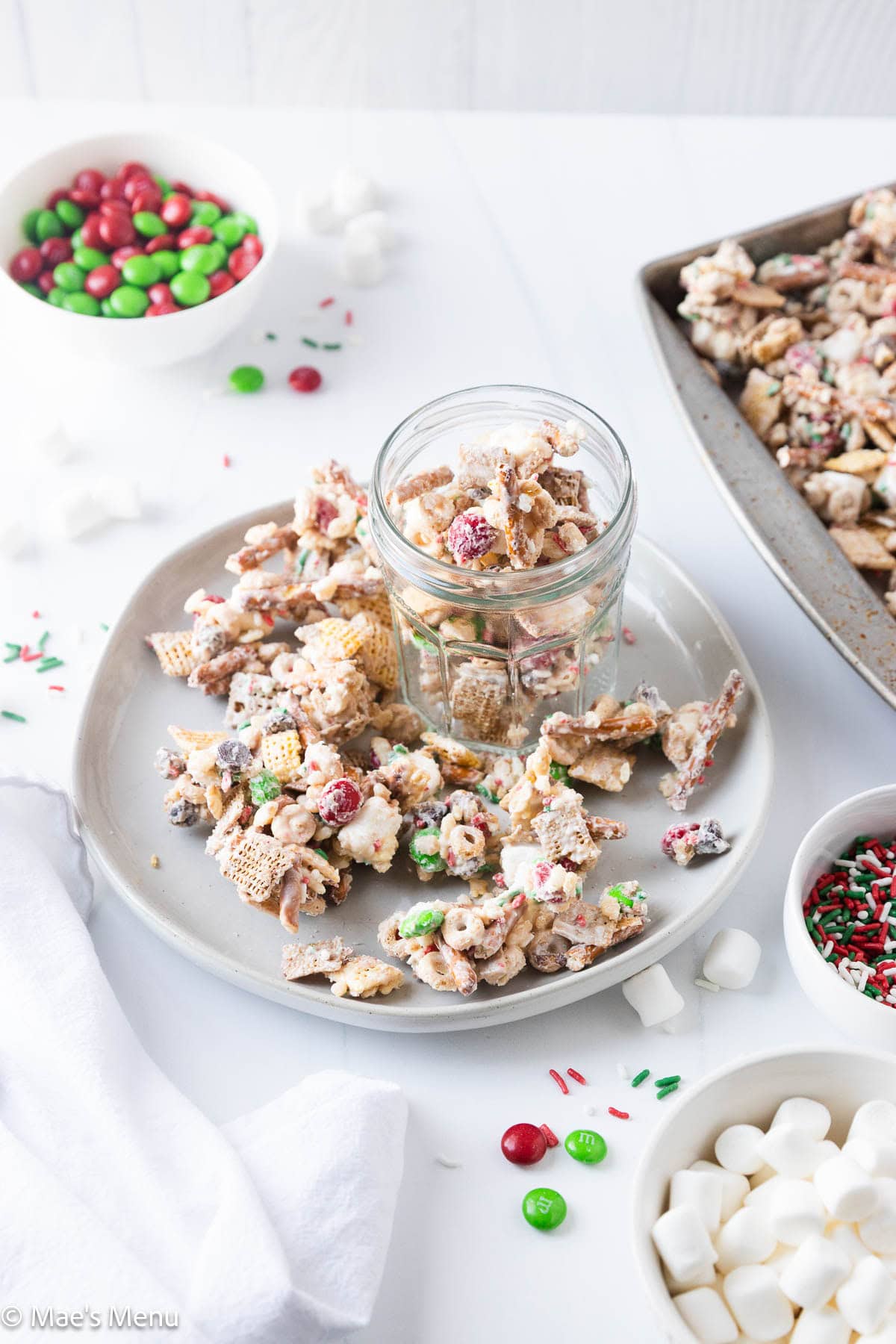 A plate of christmas chex mix.