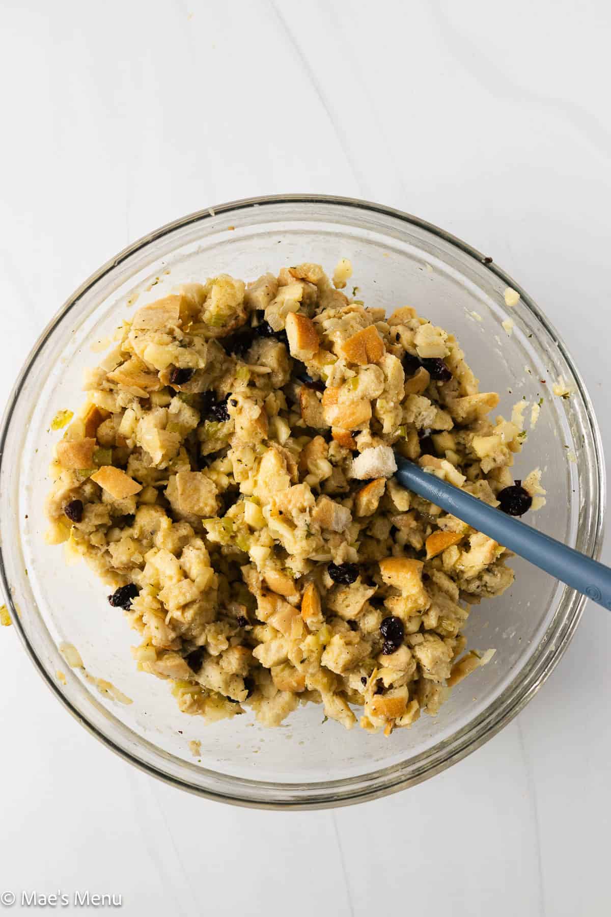A bowl full of stuffing ball mixture before scooping and rolling.