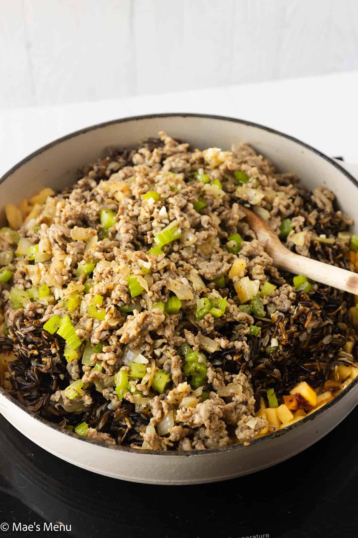 A pan of wild rice stuffing before stirring and finishing.