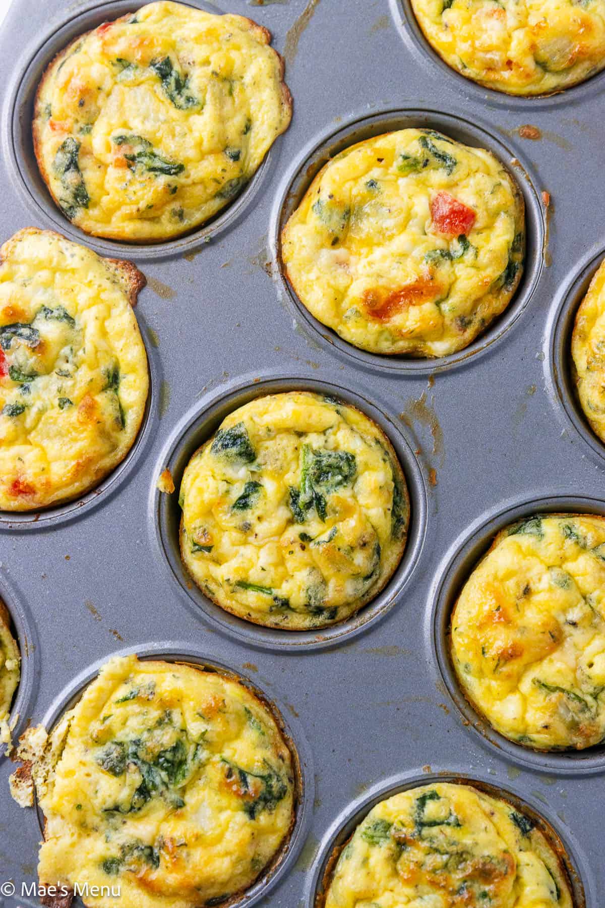A close-up shot of the cottage cheese egg muffins in the baking pan.