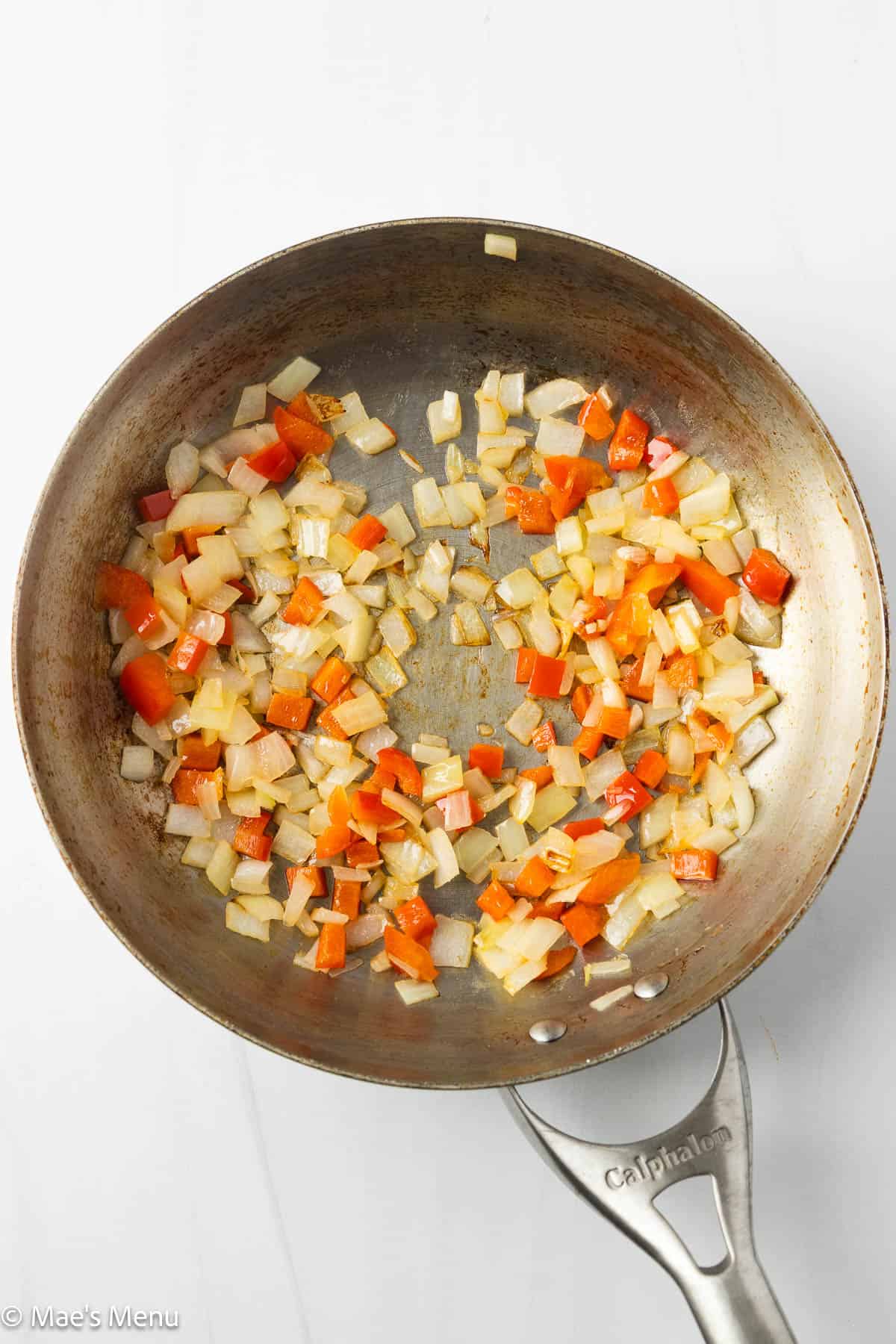 Sauteing onions and peppers in the skillet