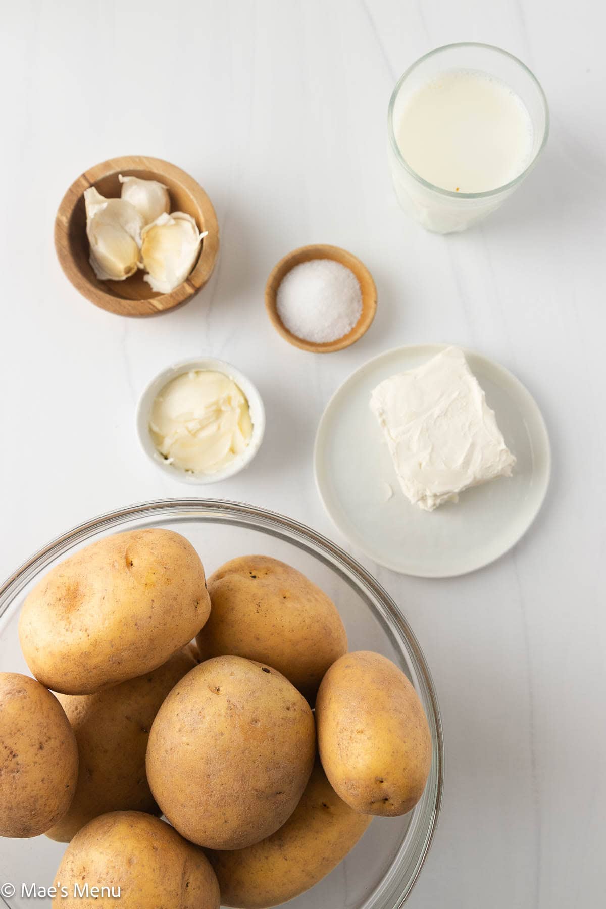 The ingredients for mashed potatoes with cream cheese on the counter.