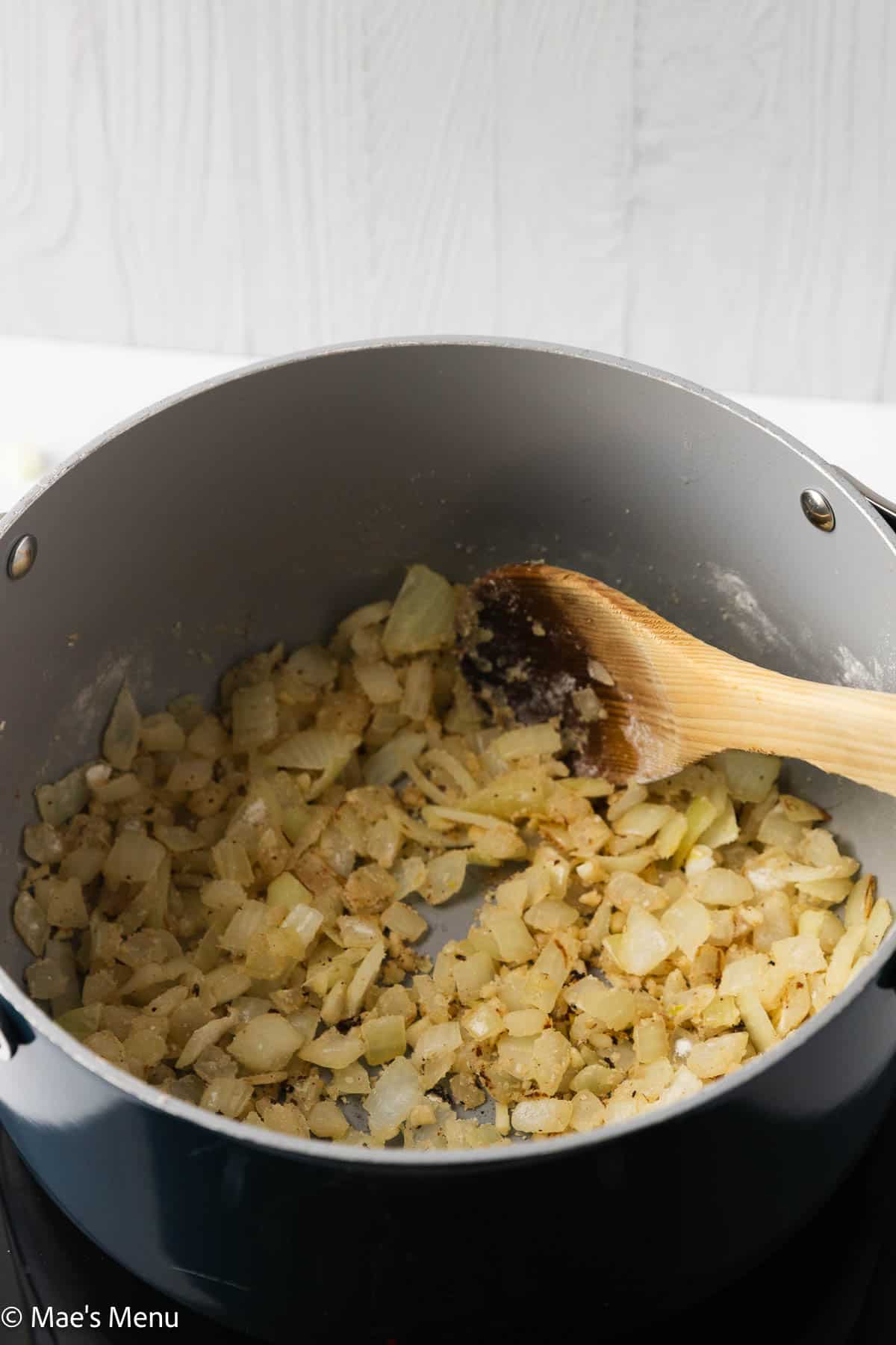 The onions toasting in flour in a pot.