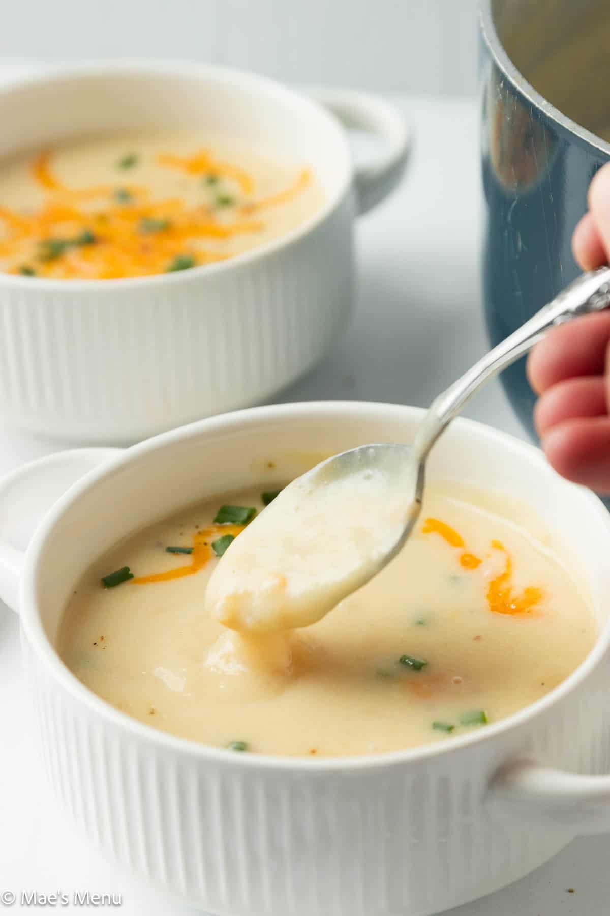 Scooping the healthy high protein potato soup recipe.